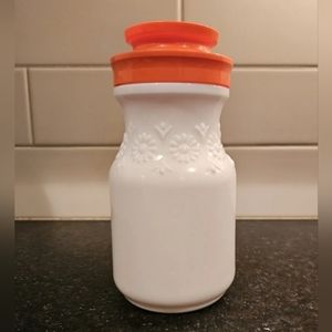 Vintage tang milk glass embossed with daisies with orange lid